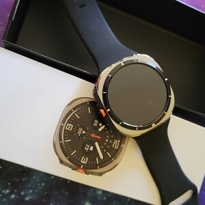 Samsung Smartwatch with Black Strap and Gold Bezel